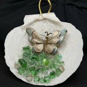 Beautiful seashell with butterfly and Green Gemstones